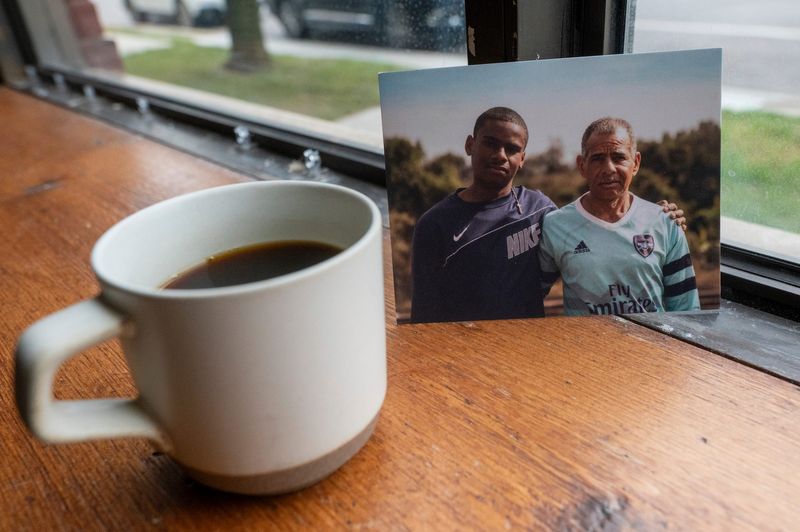 Brazilian coffee producers Lucas and Sebastiano Peixoto pictured behind a cup of Brazilian coffee at Sepia Coffee Shop in Detroit on Monday, June 30, 2025.