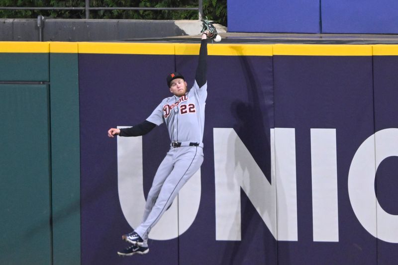 Sep 24, 2025; Cleveland, Ohio, USA; Detroit Tigers center fielder Parker Meadows (22) reaches for the ball on a two-run home run by Cleveland Guardians designated hitter George Valera (not pictured) in the third inning at Progressive Field. Mandatory Credit: David Richard-Imagn Images