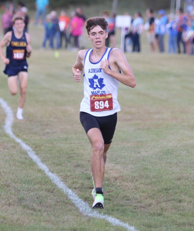 Adrian's Landin Fisher finishes 11th during the SEC White cross country jamboree Thursday, Sept. 25, 2025 at Pinckney High School.