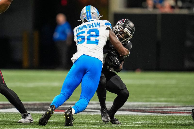 Aug 8, 2025; Atlanta, Georgia, USA; Atlanta Falcons running back Elijah Dotson (41) is tackled by Detroit Lions linebacker Zach Cunningham (52) during the first quarter at Mercedes-Benz Stadium. Mandatory Credit: Dale Zanine-Imagn Images