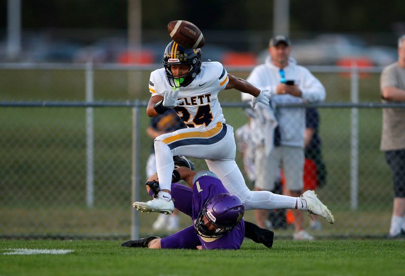 Haslett's JonQuavion Thomas (24) breaks up a pass intended for Fowlerville's Landon Aeschliman, Friday, Sept. 26, 2025, in Fowlerville.