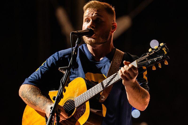 Zach Bryan performs to a sold-out crowd of over 112,000 people at Michigan Stadium in Ann Arbor on Saturday, Sept. 27, 2025.