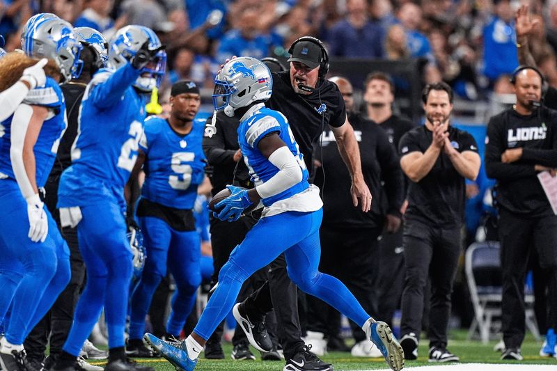 Detroit Lions head coach Dan Campbell celebrates an interception caught by safety Kerby Joseph (31) against Cleveland Browns during the first half at Ford Field in Detroit on Sunday, Sept. 28, 2025.