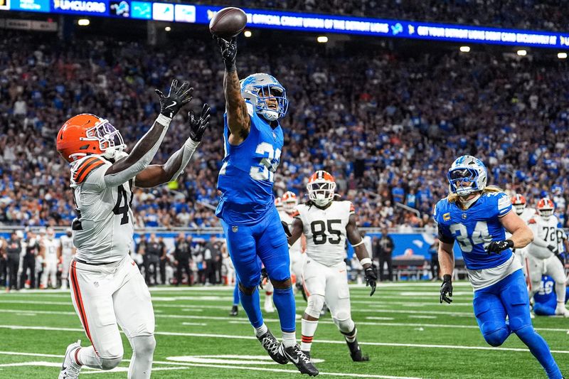 Detroit Lions safety Brian Branch (32) breaks a pass intended for Cleveland Browns tight end Harold Fannin Jr. (44) during the second half at Ford Field in Detroit on Sunday, Sept. 28, 2025.