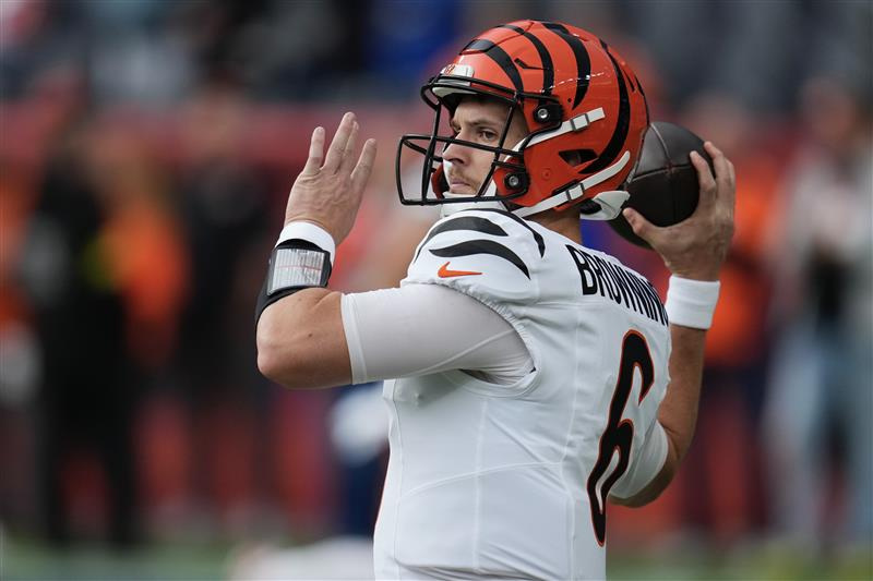 Bengals quarterback Jake Browning warms up before facing the Broncos.