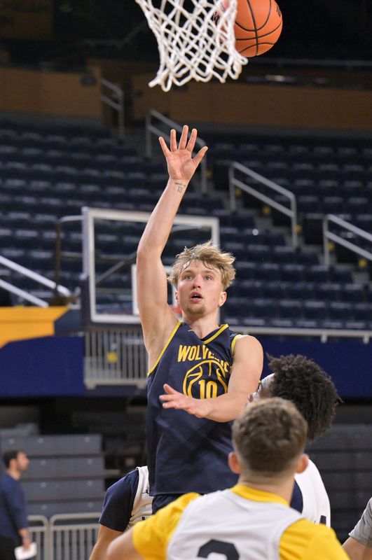 Michigan guard/forward Winters Grady puts up a shot during practice at Michigan basketball media day at Crisler Center in Ann Arbor, Mich. on Tuesday, September 30, 2025.