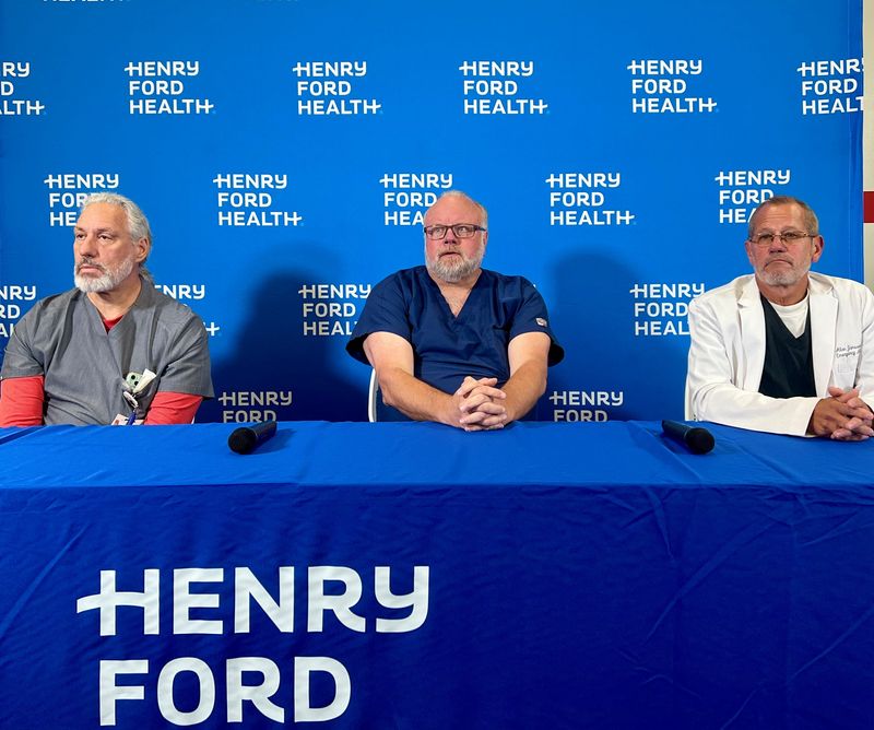 Henry Ford Genesys Hospital physicians talk during an Oct. 1, 2025 news conference at the Grand Blanc Fire Department in Grand Blanc, Michigan, about how the hospital responded to the mass shooting and fire at The Church of Jesus Christ of Latter-day Saints on Sunday, Sept. 28, 2025. Pictured, from left, are Dr. Sanford Ross, attending emergency department physician and assistant director of the emergency department, Dr. Chris Ash, medical director of surgical services and a surgeon, and Dr. Alan Janssen, director of the emergency medicine residency program and medical director of emergency medicine.