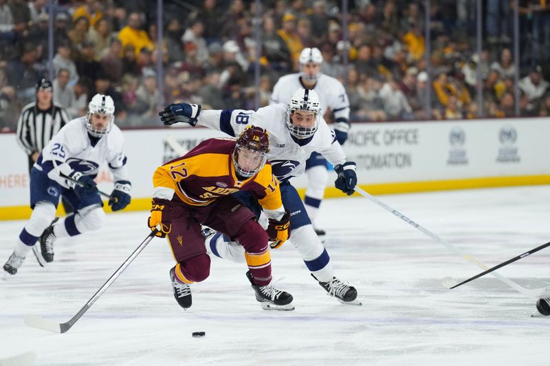 Oct 3, 2025; Tempe, AZ, USA; Arizona State Cullen Potter (12) and Penn State Aiden Fink (18) chase a puck during the first period at Mullett Arena. Mandatory Credit: Joe Camporeale-Imagn Images