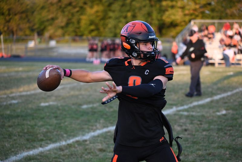 Almont quarterback Blake Lane throws a pass before a game against Armada at Almont High School on Friday, Oct. 3, 2025.