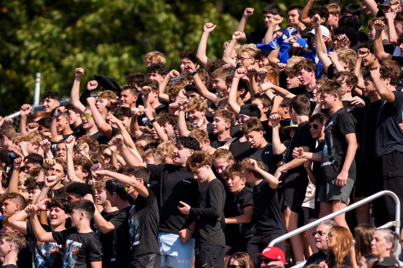 Novi Detroit Catholic Central fans cheer during a high school football game between Birmingham Brother Rice and Detroit Catholic Central in Novi on Sunday, Oct. 5, 2025.