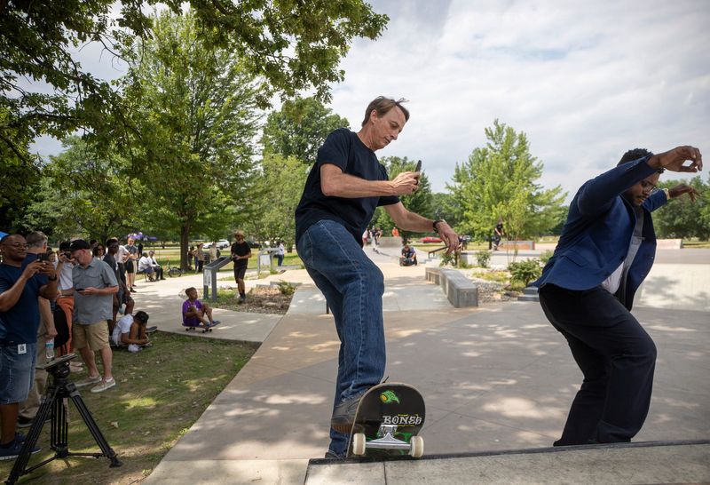 Tony Hawk, American skateboarder, skates and records Victor Williams, 28, of Detroit, at the official grand opening of the environmentally friendly Chandler Park skatepark on Detroit's east side for skateboarders, bikers, and scooters on Sunday, June 26, 2022.