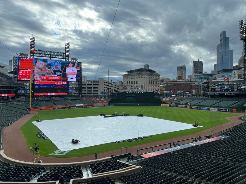 Comerica Park, home of the Detroit Tigers, covered with a tarp Thursday, Oct. 7, 2025, in Detroit, six hours before the ALDS Game 3 between the Tigers and Seattle Mariners.
