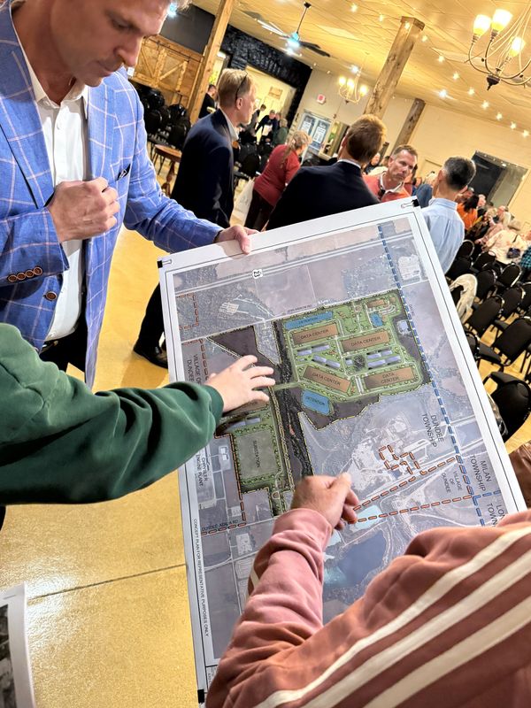Aaron Bilyeu shows concerned citizens a map of the proposed data center campus.