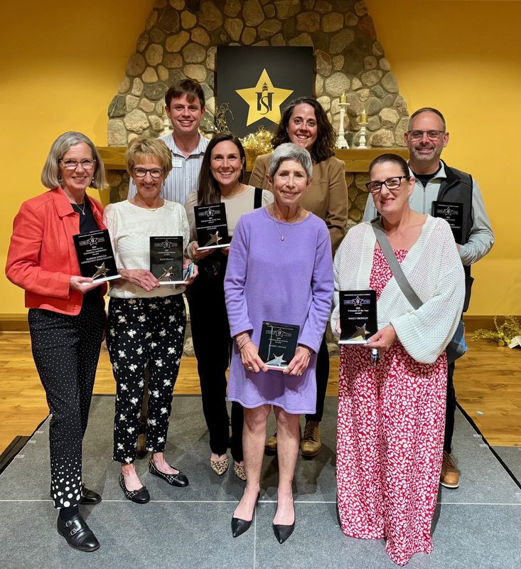 Pictured (from left, front) are 2025 Harbor Stars award winners Julie Collie, Kaye Frang, Sarah Koetje, Karen Adams, Sally Crowley, (back) Teddy Tamm, Sarah Mayhew and Scott Brown.