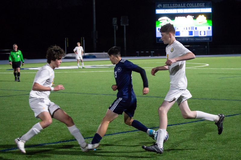Hillsdale Academy battles Will Carleton in round one of district soccer action.