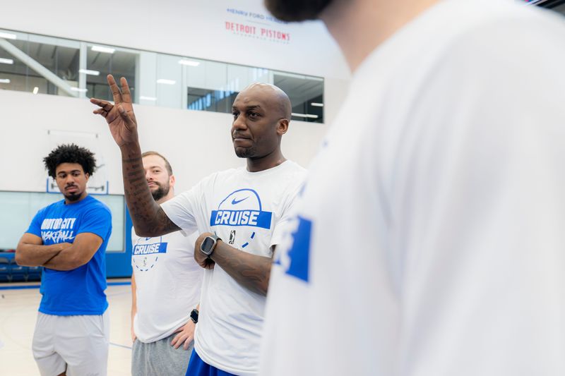 Coach Walker Russell Jr. talks with players at the Motor City Cruise's tryout session on Saturday, Sept. 20, 2025.