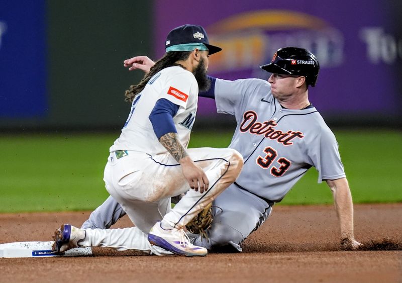 Tigers designated hitter Colt Keith steals second base against Mariners shortstop J.P. Crawford during the fourth inning of ALDS Game 5 at T-Mobile Park in Seattle on Friday, Oct. 10, 2025.