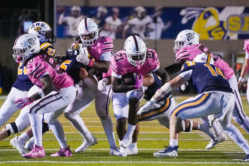 Harper Woods senior wide receiver Tylar Buford (12) runs the ball against Saline during the second half at Saline High School in Saline on Friday, Oct. 10, 2025.