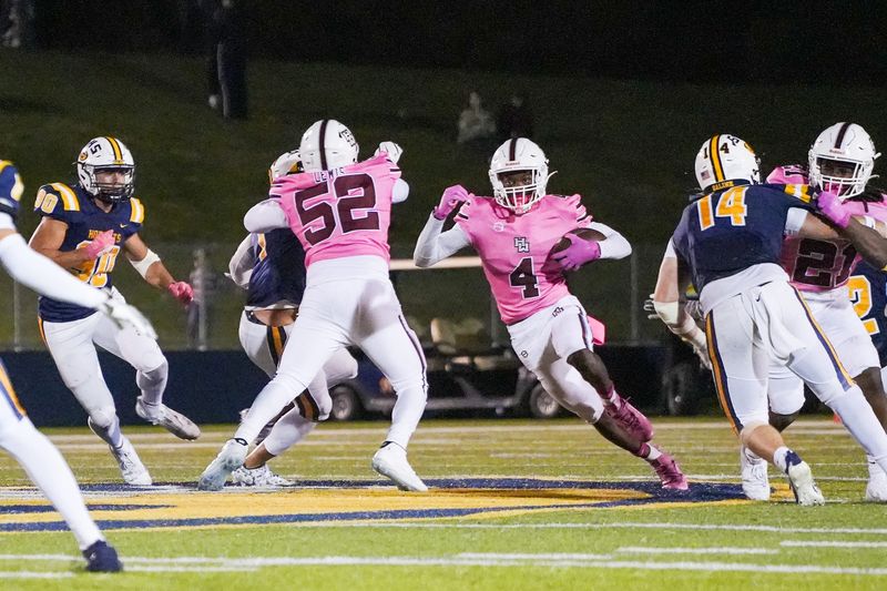 Harper Woods sophomore wide receiver Deandre Bidden (4) runs the ball against Saline during the second half at Saline High School in Saline on Friday, Oct. 10, 2025.
