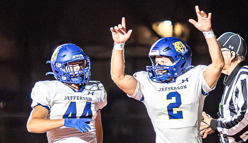 Jefferson's Luke Beaudrie celebrates a score with teammate Caleb Henry during a 53-14 victory over Grosse Ile on Friday, Oct. 10, 2025.