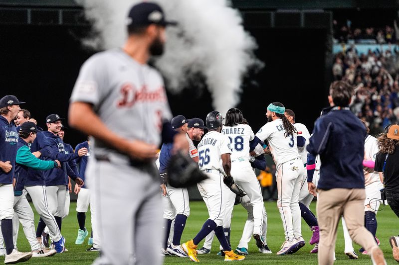 Detroit Tigers left fielder Riley Greene watches Seattle Mariners players celebrate on the field as he exits after the Tigers' 3-2 loss in 15 innings, the longest winner-take-all MLB playoff game ever, of ALDS Game 5 at T-Mobile Park in Seattle on Friday, Oct. 10, 2025.