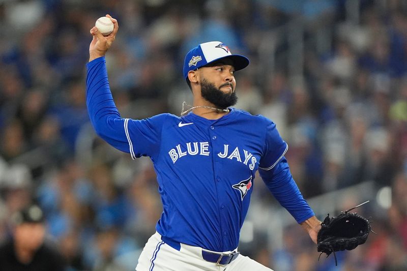 Oct 12, 2025; Toronto, Ontario, CAN; Toronto Blue Jays pitcher Seranthony Dominguez (48) pitches against the Seattle Mariners in the eighth inning during game one of the ALCS round for the 2025 MLB playoffs at Rogers Centre.