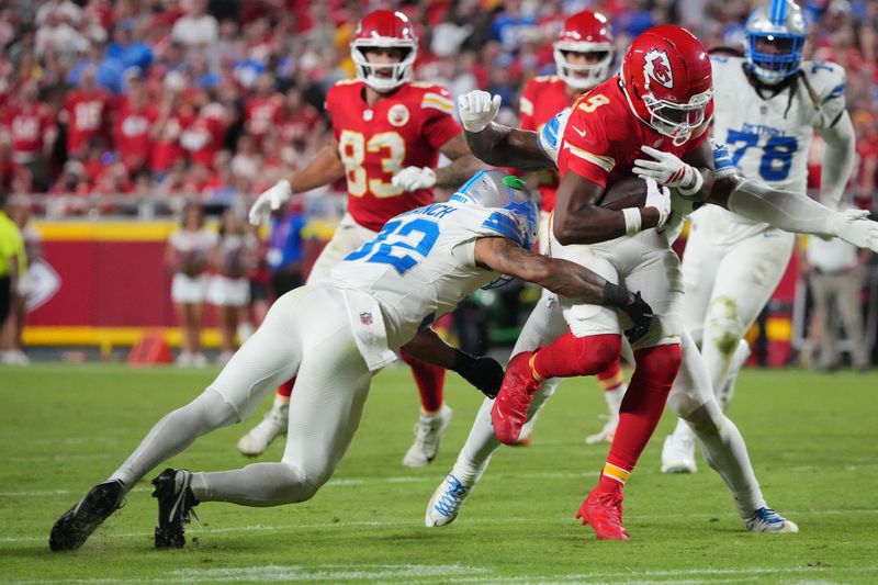 Kansas City Chiefs wide receiver Juju Smith-Schuster makes a catch over Detroit Lions safety Brian Branch during the second half at GEHA Field at Arrowhead Stadium, Oct. 12, 2025 in Kansas City.