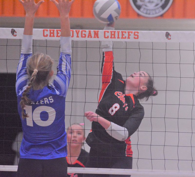 Cheboygan senior Olivia Patrick (8) attacks while Kalkaska's Grace Denike (10) attempts to block during the first set of a volleyball match at Cheboygan on Tuesday, Oct. 14.