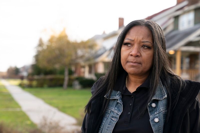 LaJuan Counts, demolition department director for the city of Detroit, speaks to the news media as her team works to stabilize two houses on Ivanhoe Street in Detroit on Nov. 18, 2021.