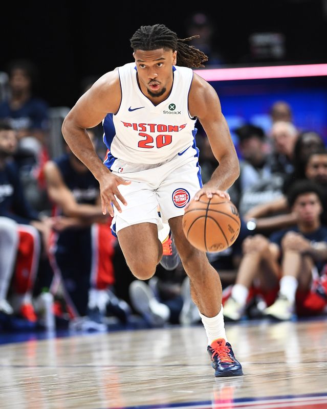 Detroit Pistons guard Chaz Lanier (20) drives the ball upcourt in the second quarter. Detroit Pistons vs Washington Wizards at Little Caesars Arena on October 16, 2025, in Detroit, MI.