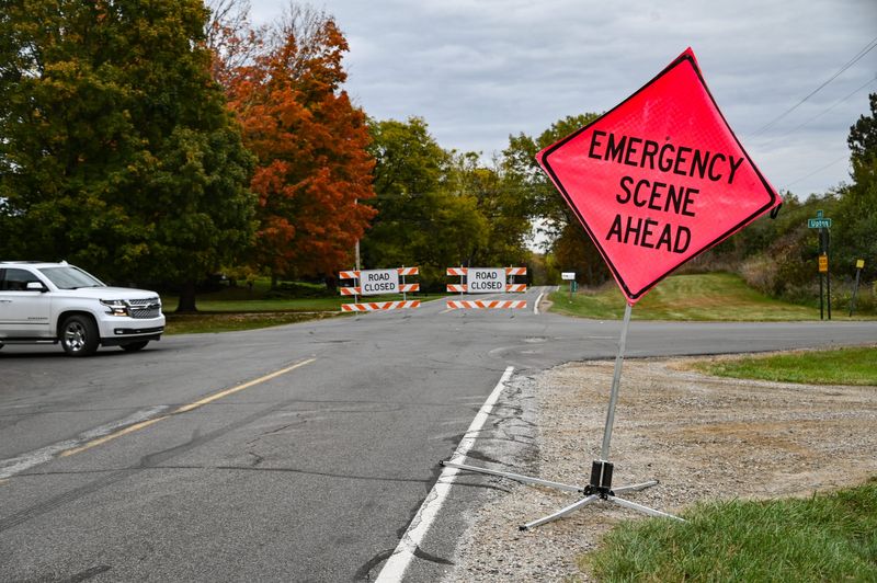 The corner of Upton and Clark Roads in Bath Township, seen Friday, Oct. 17, 2025. A plane crashed in a wooded area south of Clark Road Thursday evening, killing all three aboard.