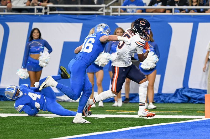 Sep 14, 2025; Detroit, Michigan, USA; Chicago Bears wide receiver Rome Odunze (15) carries the ball for a touchdown defended by Detroit Lions linebacker Jack Campbell (46) and cornerback D.J. Reed (4)