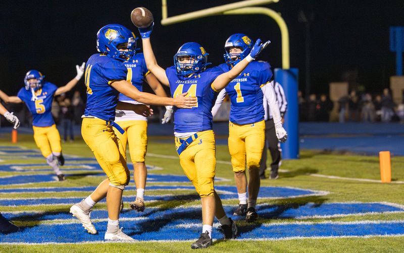 Jefferson's Caleb Henry (44) and his teammates celebrate his touchdown against St. Mary Catholic Central during a 20-15 SMCC win on Friday, Oct. 17, 2025.