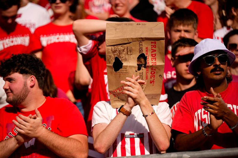 A Wisconsin Badger fan wears a bag on his head in the first half at Camp Randall Stadium on Saturday, Oct. 18, 2025 in Madison, Wisconsin.
