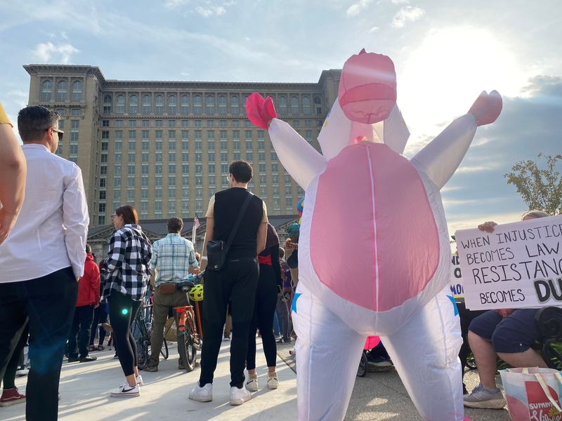 Krista Wollam, 50, of Livonia, is shown at a No Kings protest on Saturday, Oct. 18, 2025, at Roosevelt Park in Detroit.