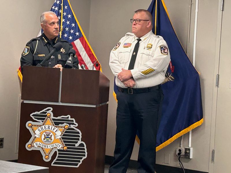 Macomb County Sheriff Anthony Wickersham, left, stands next to Roseville Police Chief Mitch Berlin during a news conference Oct. 23, 2025 at the county jail in Mount Clemens regarding an officer-involved shooting in Roseville ten days earlier.