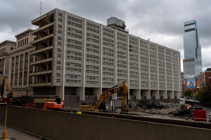 An excavator sits near the Old Wayne County Jail as demolition work continues, downtown Detroit, Thursday, Oct. 23, 2025. Bedrock obtained a permit to tear down the nine-story structure.