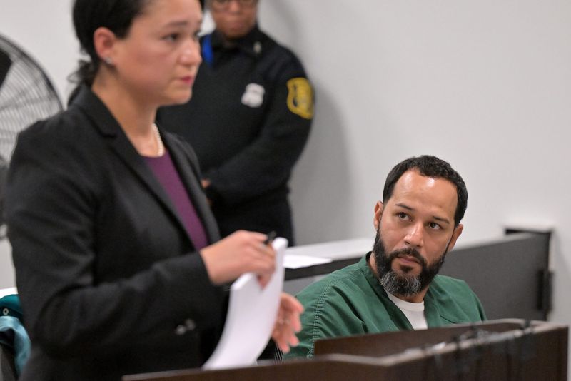 Defendant Wilfredo Figueroa-Berrios, right, looks over at Wayne County Assistant Prosecutor Grace Broughton during the preliiminary examination for the sexual assault cases against defendant Wilfredo Figueroa-Berrios at 36th District Court in Detroit on October 23, 2025.