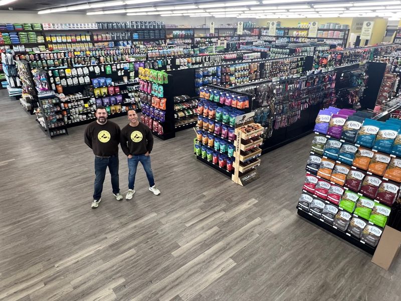 Brandon Thorne and Mike Palmer, co-owners of Premier Pet Supply, in the newly opened store at 750 General Motors Road in Milford.