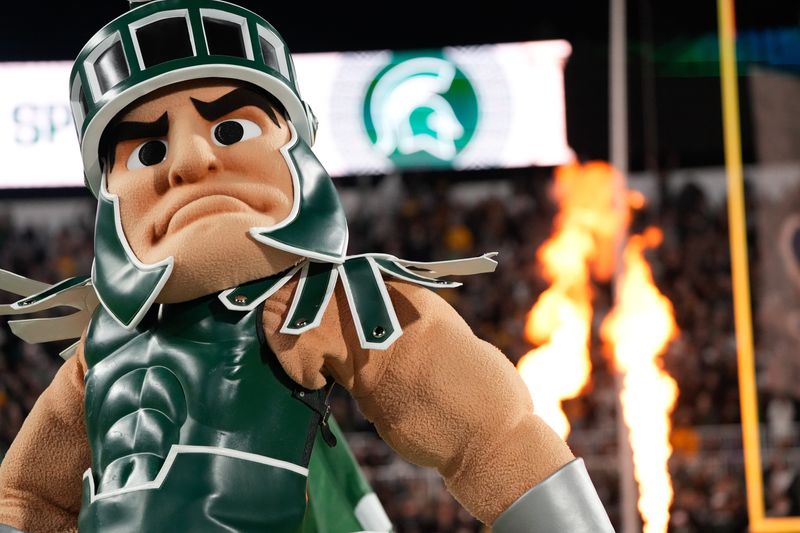 Oct 25, 2025; East Lansing, Michigan, USA; Sparty leads the Michigan State Spartans onto the field prior at a game against the Michigan Wolverines at Spartan Stadium. Mandatory Credit: Brendan Mullin-Imagn Images