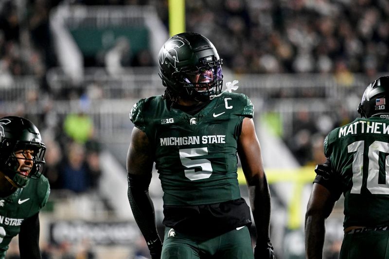 Michigan State's Jordan Hall celebrates after a stop against Michigan during the second quarter on Saturday, Oct. 25, 2025, at Spartan Stadium in East Lansing.