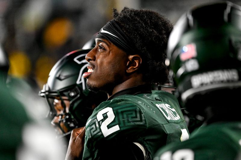 Michigan State's Aidan Chiles looks on from the sideline late during the fourth quarter in the game against Michigan on Saturday, Oct. 25, 2025, at Spartan Stadium in East Lansing.