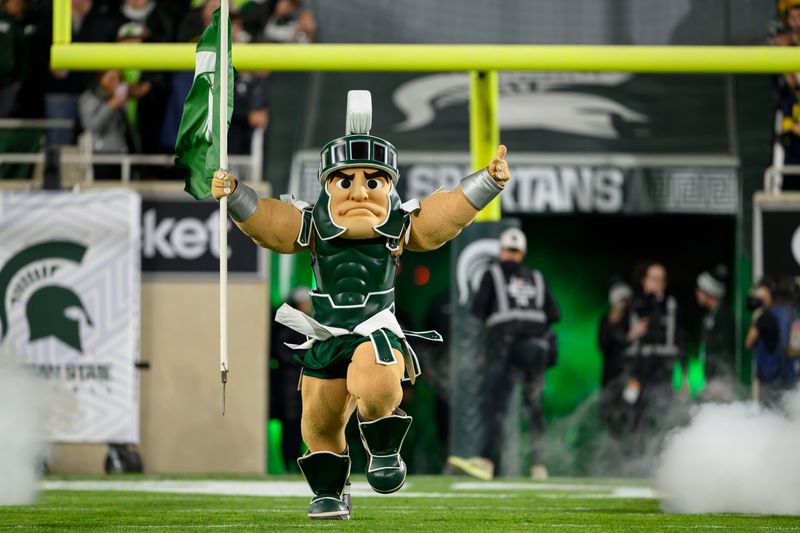Sparty, the Michigan State mascot, runs out onto the field before the start of a game between Michigan State University and the University of Michigan, at Spartan Stadium, in East Lansing, October 25, 2025.