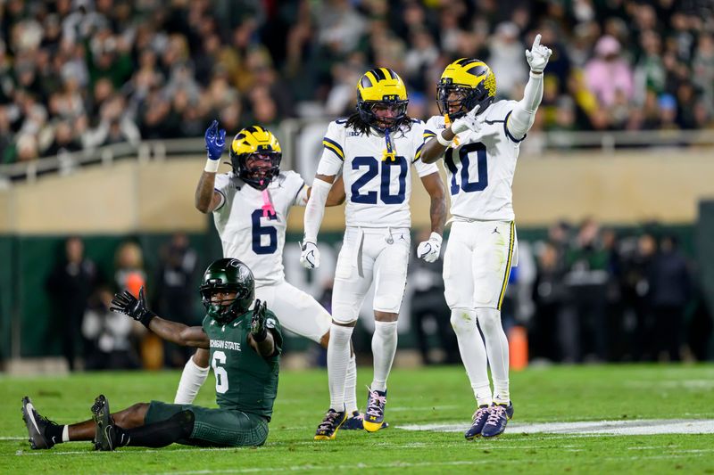 Returning starters Zeke Berry, right, and Jyaire Hill, center, appear to be set at the corners for Michigan.