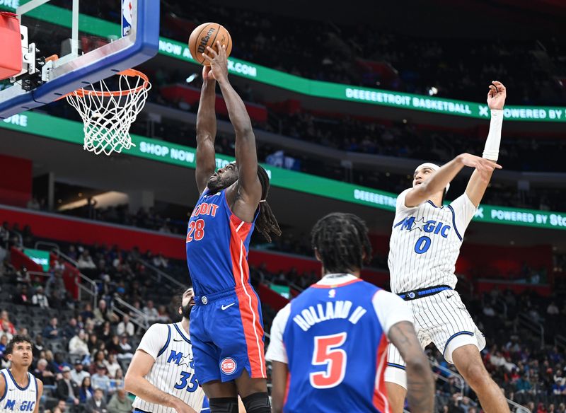 Detroit Pistons forward/center Isaiah Stewart (28) dunks over Orlando Magic guard Anthony Black (0) in the second quarter. Detroit Pistons vs Orlando Magic at Little Caesars Arena on October 29, 2025, in Detroit, MI.