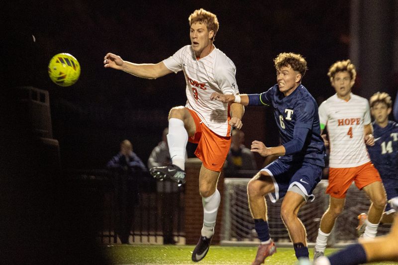 Hope's Jackson Mindling, left, plays the ball against Trine on Wednesday, Oct. 29, 2025, at Hope's Van Andel Soccer Stadium.