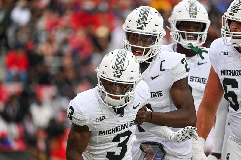Sep 7, 2024; College Park, Maryland, USA; Michigan State Spartans wide receiver Montorie Foster Jr. (3) and quarterback Aidan Chiles (2) celebrate after a first half touchdown against the Maryland Terrapins at SECU Stadium. Mandatory Credit: Tommy Gilligan-Imagn Images