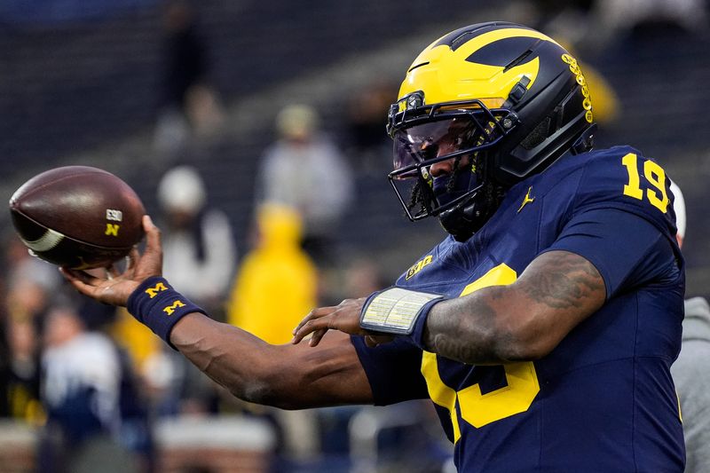 Michigan quarterback Bryce Underwood (19) warms up ahead of the Purdue game at Michigan Stadium in Ann Arbor on Saturday, November 1, 2025.