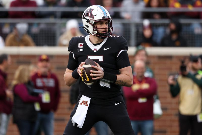 Nov 1, 2025; Minneapolis, Minnesota, USA; Minnesota Golden Gophers quarterback Drake Lindsey (5) looks to throw against the Michigan State Spartans during the second half at Huntington Bank Stadium. Mandatory Credit: Matt Krohn-Imagn Images