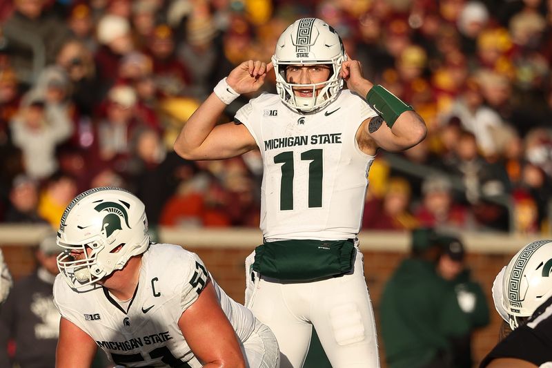 Nov 1, 2025; Minneapolis, Minnesota, USA; Michigan State Spartans quarterback Alessio Milivojevic (11) calls a play against the Minnesota Golden Gophers during the second half at Huntington Bank Stadium. Mandatory Credit: Matt Krohn-Imagn Images